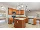 Kitchen featuring granite countertops, stainless appliances, and a center island at 9308 Carisbrook Ct, Raleigh, NC 27615