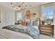 Cozy bedroom with decorative wall accents and modern lighting at 10011 Secluded Gdn Dr # 169, Apex, NC 27523