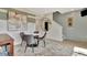 Dining area featuring a modern table set, artwork, neutral tones, and hardwood floors at 10011 Secluded Gdn Dr # 169, Apex, NC 27523