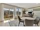 Bright dining area with a sliding glass door, office area, and hardwood floors at 10011 Secluded Gdn Dr # 169, Apex, NC 27523