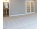 Large basement featuring neutral walls, carpet and French doors at 1011 Coldspring Circle, Durham, NC 27705