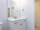 Bathroom vanity featuring a white cabinet, white countertops and a framed mirror at 1011 Coldspring Circle, Durham, NC 27705