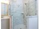 Bathroom featuring glass shower with marble tile and chrome showerhead at 1011 Coldspring Circle, Durham, NC 27705