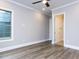 Bedroom featuring hardwood floors, natural light, and neutral paint at 1011 Coldspring Circle, Durham, NC 27705