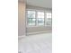 Bedroom showcasing triple windows and plush carpeting at 1011 Coldspring Circle, Durham, NC 27705