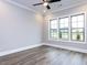 Bedroom featuring hardwood floors and large windows at 1011 Coldspring Circle, Durham, NC 27705