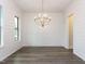 Dining room with white shiplap walls, and a modern chandelier at 1011 Coldspring Circle, Durham, NC 27705