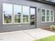 Back patio of home with large windows providing ample natural light to the interior space at 1011 Coldspring Circle, Durham, NC 27705