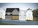Charming new construction townhomes with traditional architectural elements, manicured landscaping and attached garages at 1011 Coldspring Circle, Durham, NC 27705