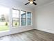 Living room featuring hardwood floors, natural lighting, and view of yard at 1011 Coldspring Circle, Durham, NC 27705