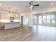 Spacious open floorplan with hardwood floors, island kitchen, and large windows at 1011 Coldspring Circle, Durham, NC 27705