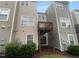 Multi-level back decks for outdoor enjoyment, surrounded by well-maintained landscaping and greenery at 102 Darley Dale Loop, Apex, NC 27502
