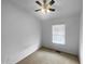 Bedroom featuring a ceiling fan, large window, and wall to wall carpet at 102 Darley Dale Loop, Apex, NC 27502