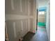 Bathroom featuring drywall, a window, plumbing fixtures, and tiled floors, offering a modern touch at 1027 Coldspring Circle, Durham, NC 27705