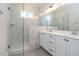 Bathroom featuring a glass shower, marble tile, double vanity, and modern fixtures at 1027 Coldspring Circle, Durham, NC 27705