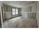 Bedroom featuring drywall, two windows for natural light, and a spacious layout at 1027 Coldspring Circle, Durham, NC 27705