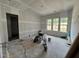 Unfinished bedroom with three windows, offering natural light and ready for customization at 1027 Coldspring Circle, Durham, NC 27705