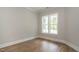 Bedroom with hardwood floors and a window providing natural light at 1027 Coldspring Circle, Durham, NC 27705