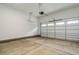Clean, empty two-car garage with concrete floor and bright lighting at 1027 Coldspring Circle, Durham, NC 27705