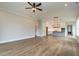 Spacious living room with hardwood flooring, lots of natural light, and open floorplan at 1027 Coldspring Circle, Durham, NC 27705