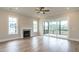 Cozy living room with fireplace and access to the screened in patio at 1027 Coldspring Circle, Durham, NC 27705