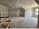 Spacious living room area featuring drywall and ample natural light from a window at 1027 Coldspring Circle, Durham, NC 27705