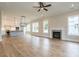 Open-concept living room and kitchen area with natural light and hardwood flooring at 1027 Coldspring Circle, Durham, NC 27705