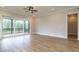 Bright living room with sliding glass doors leading to a screened porch and views of the backyard at 1027 Coldspring Circle, Durham, NC 27705