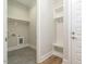 Mud room and laundry room featuring tile flooring, a bench, and storage hooks at 1027 Coldspring Circle, Durham, NC 27705