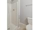 Neutral bathroom featuring a white shower and toilet at 106 Gumdrop Path, Apex, NC 27502