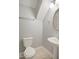 Neutral bathroom featuring a pedestal sink and toilet at 106 Gumdrop Path, Apex, NC 27502