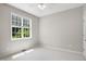 Bright bedroom featuring a ceiling fan, a double hung window, and neutral walls at 106 Gumdrop Path, Apex, NC 27502