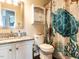 Bathroom features a turtle themed shower curtain and granite countertop at 1100 Open Field Dr, Garner, NC 27529