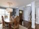 Elegant dining room with hardwood floors, chandelier, and ample natural light at 1100 Open Field Dr, Garner, NC 27529