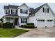 Beautiful two-story home with a well-manicured lawn and a spacious driveway at 1100 Open Field Dr, Garner, NC 27529