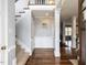 Inviting foyer with hardwood floors, staircase, and detailed trim work at 1100 Open Field Dr, Garner, NC 27529