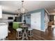 This bright kitchen boasts stainless steel appliances and a green island with stool seating at 1100 Open Field Dr, Garner, NC 27529