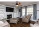 Cozy living room with fireplace, built-in shelving, and hardwood floors at 1100 Open Field Dr, Garner, NC 27529