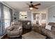 Cozy living room with hardwood floors, a ceiling fan, and comfortable seating area at 1100 Open Field Dr, Garner, NC 27529
