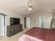 Spacious main bedroom with a ceiling fan, closet, and en-suite bathroom at 1100 Open Field Dr, Garner, NC 27529
