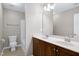 Bathroom with double vanity, tub, and great lighting fixtures at 112 Briarfield Dr, Apex, NC 27502