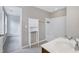 Bright bathroom featuring tiled floors, a tub, and ample storage space at 112 Briarfield Dr, Apex, NC 27502