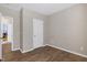 Empty bedroom featuring hardwood floors, neutral tones, and lots of natural light at 112 Briarfield Dr, Apex, NC 27502