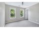 Bedroom with carpet, neutral walls, and windows at 112 Briarfield Dr, Apex, NC 27502