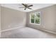 Neutral bedroom showcasing a plush carpet and lots of natural light at 112 Briarfield Dr, Apex, NC 27502