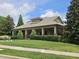 A beautiful clubhouse with a covered porch and well-manicured landscaping at 112 Briarfield Dr, Apex, NC 27502