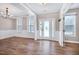 Formal dining room featuring wainscoting, hardwood floors, and a chandelier at 112 Briarfield Dr, Apex, NC 27502