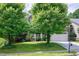 Charming two-story home with stone accents, a two-car garage, and beautifully landscaped front yard at 112 Briarfield Dr, Apex, NC 27502