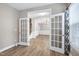 Open foyer showcasing glass french doors leading to a formal dining room with natural light at 112 Briarfield Dr, Apex, NC 27502