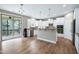 Well-lit kitchen features stainless steel appliances, a breakfast bar, pantry, and access to the deck at 112 Briarfield Dr, Apex, NC 27502